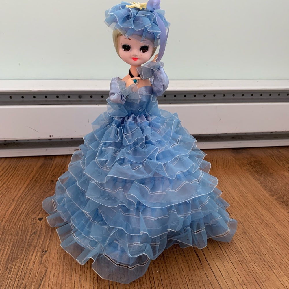Blue dressed posable doll